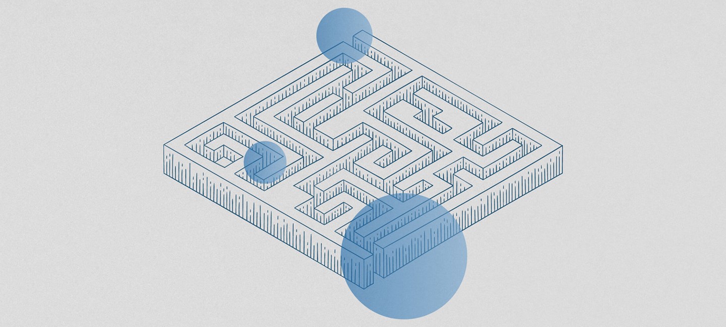 Illustration of a labyrinth with three blue dots on it.