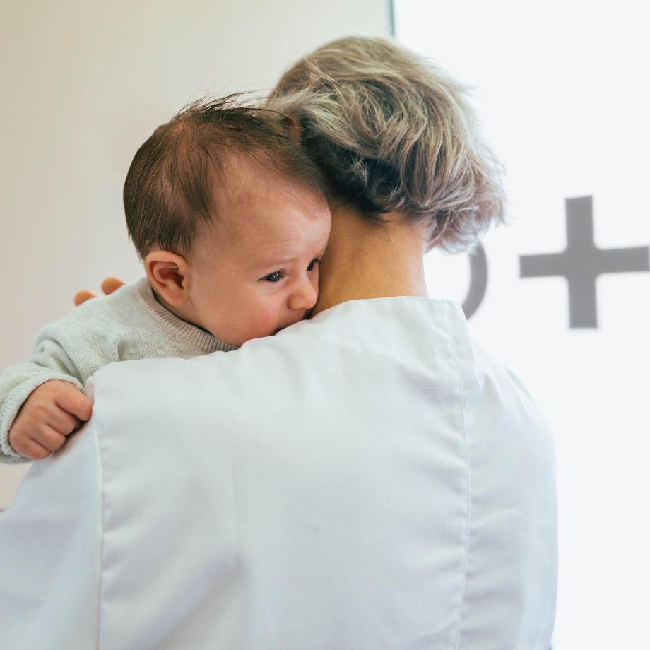 A woman holding a baby